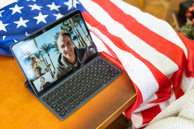 Tablet pc computer on american flag, technology, patriotism, anniversary, national holidays and independence day.