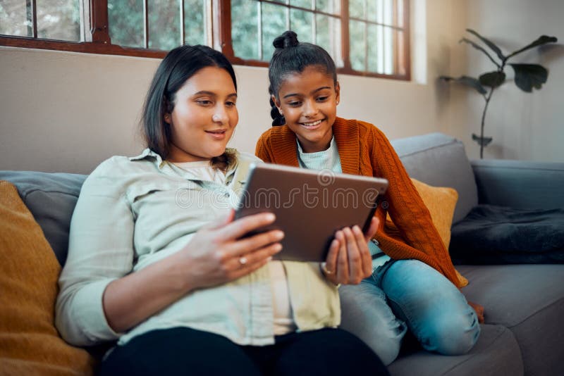 Tablet, pregnant mother and girl watching cartoon and children movie streaming on a sofa. Mom, child and internet gaming together with bonding, love and care on a home living room couch.