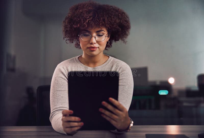 Tablet, programmer and woman in night office, research or programming online in workplace. Information technology stock images