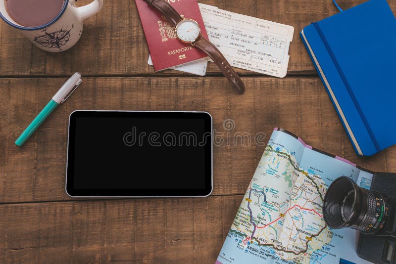 Tablet on a table to plan and organize a trip