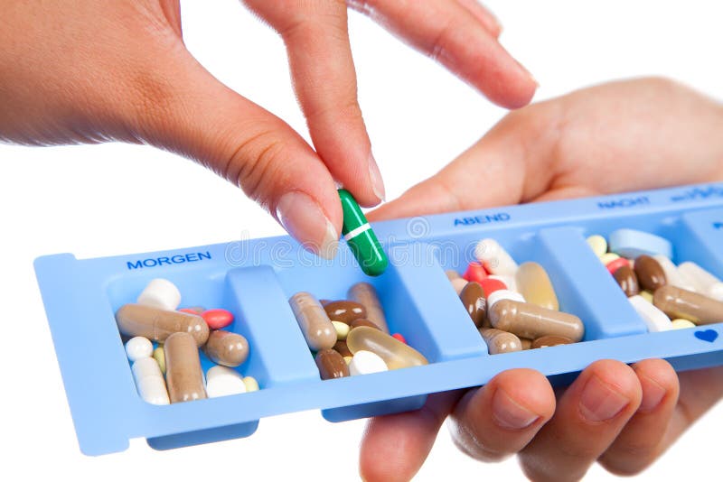 Tablet und Kapsel im täglichen Pillenkasten