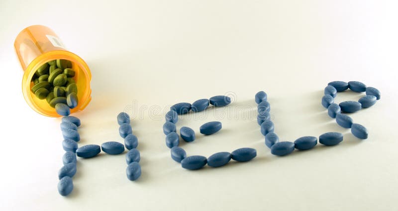 Big blue pills spell the word help. Big blue pills spell the word help.