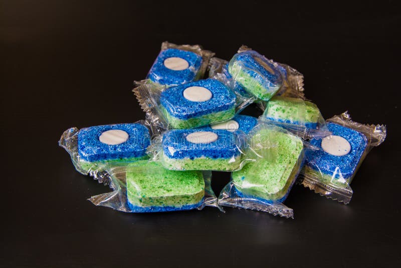 Tablets for Dishwashing Machine on a Black Background. Stock Photo
