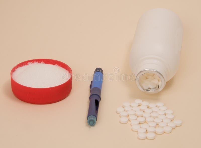 Diabetes injection pen, Tablets and Sugar on a cream background.