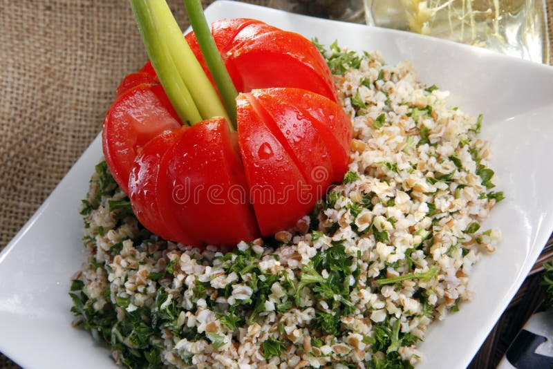 Middle eastern Tabouli bulgur wheat and parsley salad, seasoned with lime juice. Middle eastern Tabouli bulgur wheat and parsley salad, seasoned with lime juice