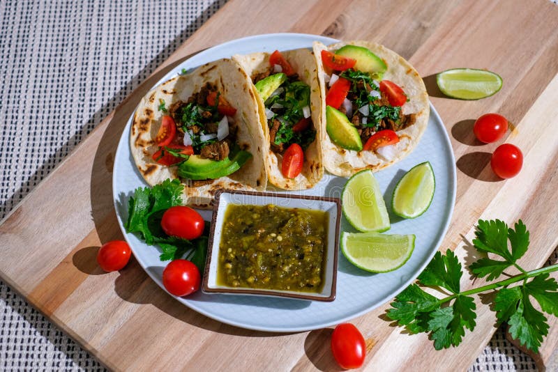 Taco with Lime ,tomato and Salsa . Healthy Diet Food Stock Photo