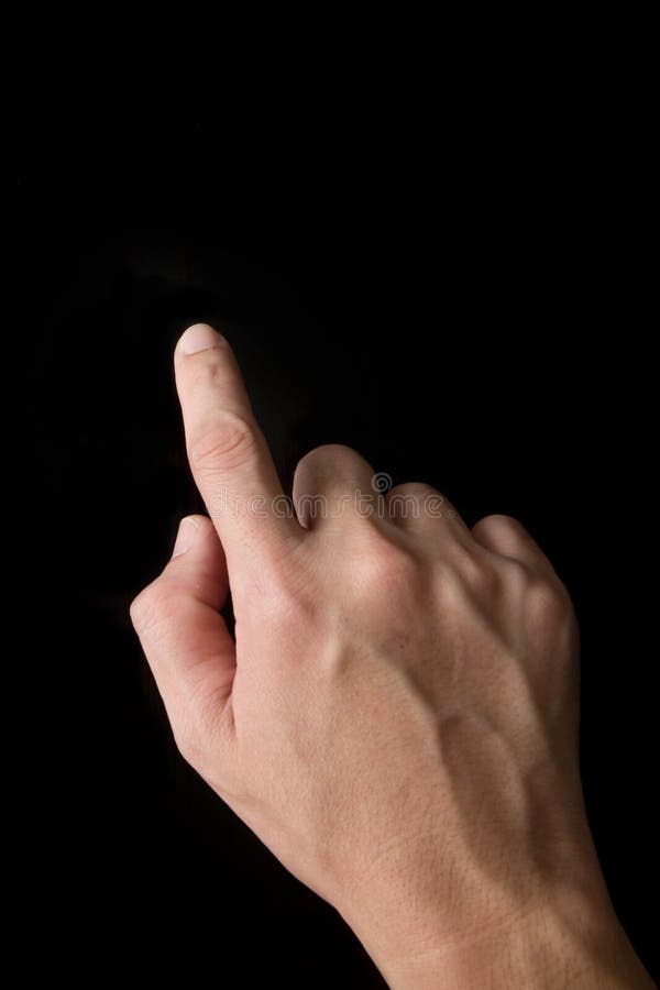 Index finger touching screen isolated on black background. Index finger touching screen isolated on black background