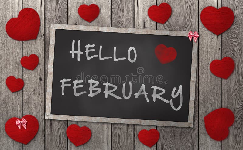 Blackboard with words hello february, surrounded by red hearts, on vintage wooden background. Blackboard with words hello february, surrounded by red hearts, on vintage wooden background