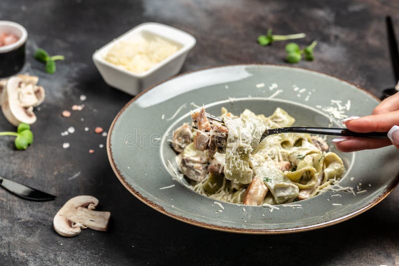 Tagliatelle Pasta with Mushrooms and Chicken in Creamy Cheese Sauce