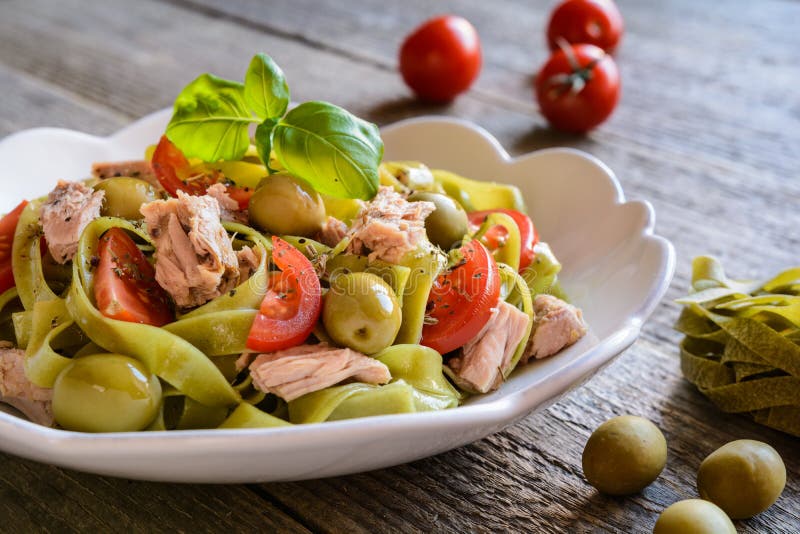 Tagliatelle Pasta with Tuna Fish, Tomato and Olives Stock Photo Image