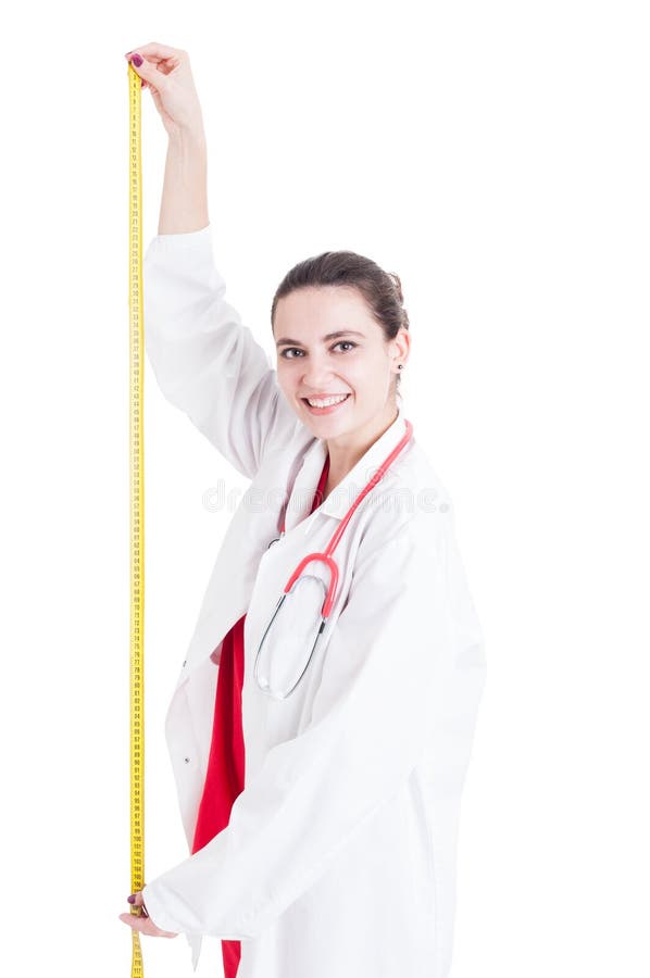 Taille de mesure de docteur gai de femme photo stock Taille de mesure de docteur gai de femme photo stock