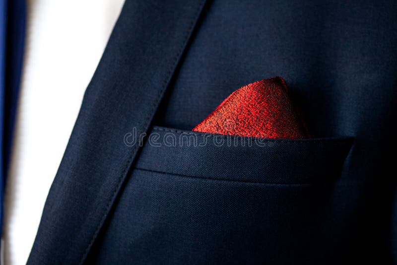 Men`s pocket square close up. Male marriage suit closeup. Style for a very special day. Male in blue suit set closeup. Men`s pocket square close up. Male marriage suit closeup. Style for a very special day. Male in blue suit set closeup