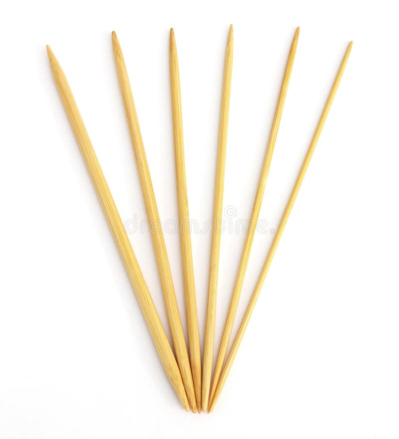 Wooden bamboo knitting needles in different sizes. Isolated on white. Wooden bamboo knitting needles in different sizes. Isolated on white.