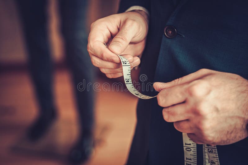 male hands with tailor measuring tape isolated 12570441 Stock