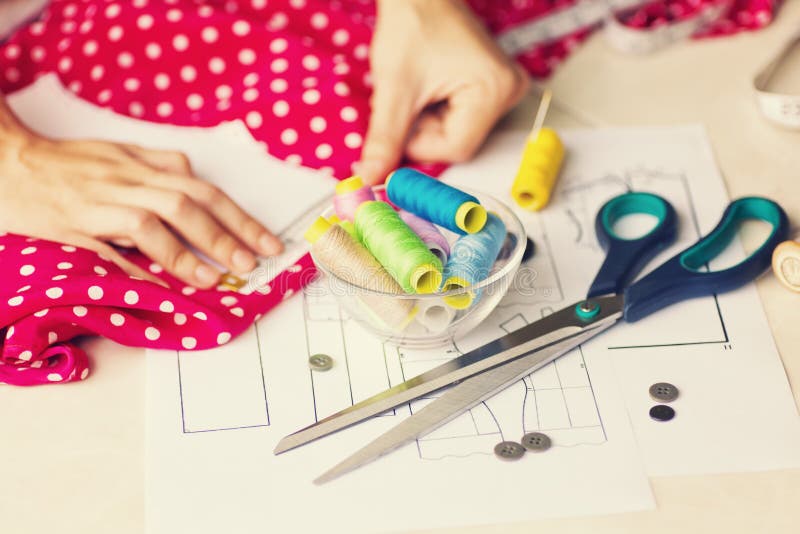 A Tailor is Laying Out a Dress/Sewing Layout Stock Photo - Image of ...