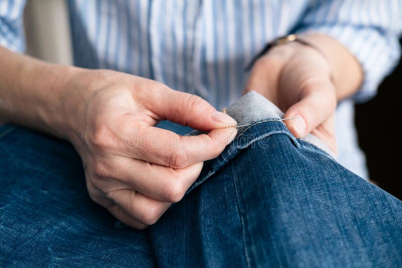 Tailor Sew the Hem of Jeans in Stock Photo Image of