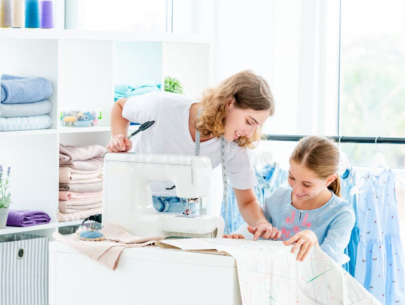 Tailor is teaching student royalty free stock photos