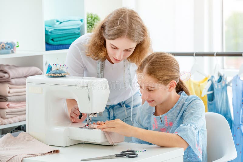 Tailor is teaching student stock photo