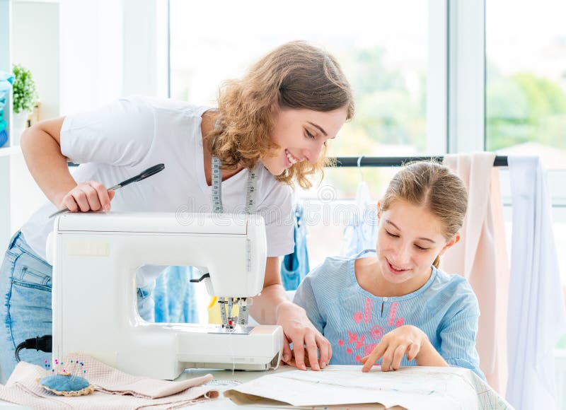 Tailor is teaching student stock image