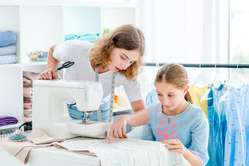 Tailor is teaching student stock photo