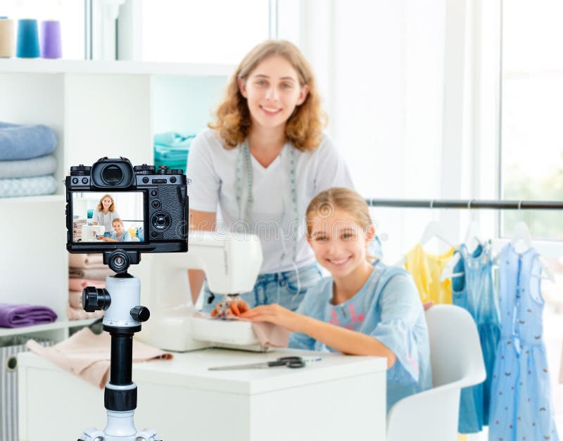 Tailor is teaching student stock image