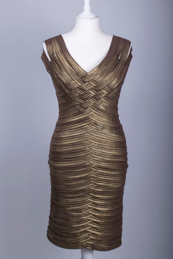 Tailors Mannequin Dressed in a Long Gold Satin Dress Stock Image