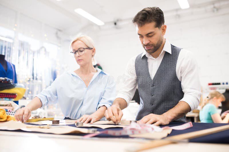 Tailors Working at Table in Atelier Studio Stock Image - Image of male ...