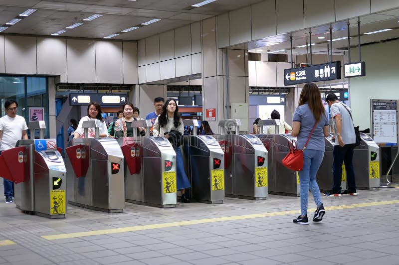 Motion of people walking through the fare pay zone for taking MRT stock images Motion of people walking through the fare pay zone for taking MRT stock images