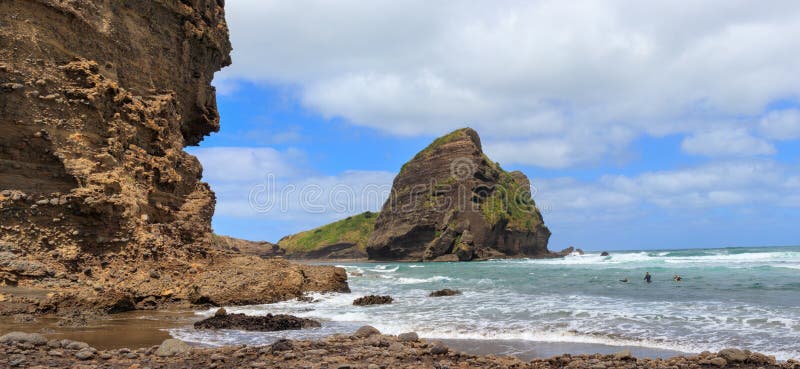 Taitomo Island at Piha Beach panoramic view, New Zealand royalty free stock photo Taitomo Island at Piha Beach panoramic view, New Zealand royalty free stock photo