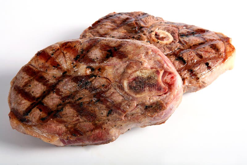 Tajadas asadas a la parilla de la pierna del cordero fotografía de archivo libre de regalías Tajadas asadas a la parilla de la pierna del cordero fotografía de archivo libre de regalías