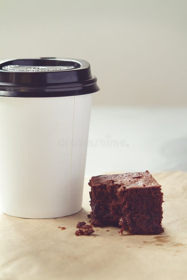 Take Away Coffee Cup and Chocolate Brownie in Muted Tones Stock Image