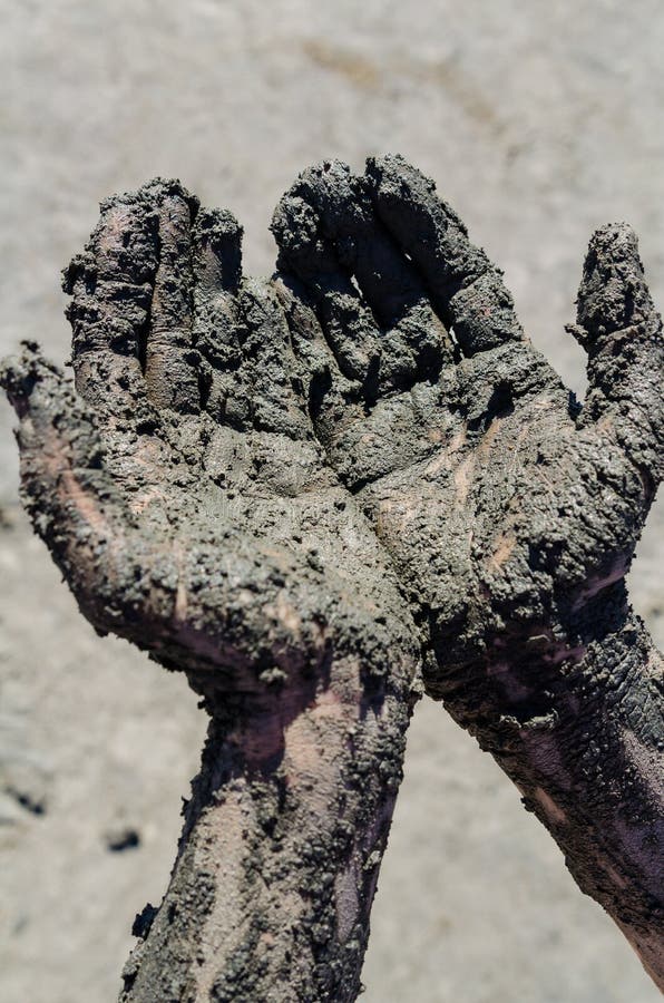 Take a Mud Cure. Healthy Medical Procedure. Dirty Hands Stock Photo