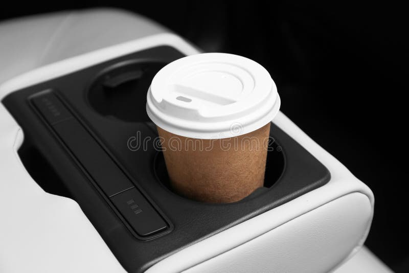 Takeaway paper coffee cup in holder