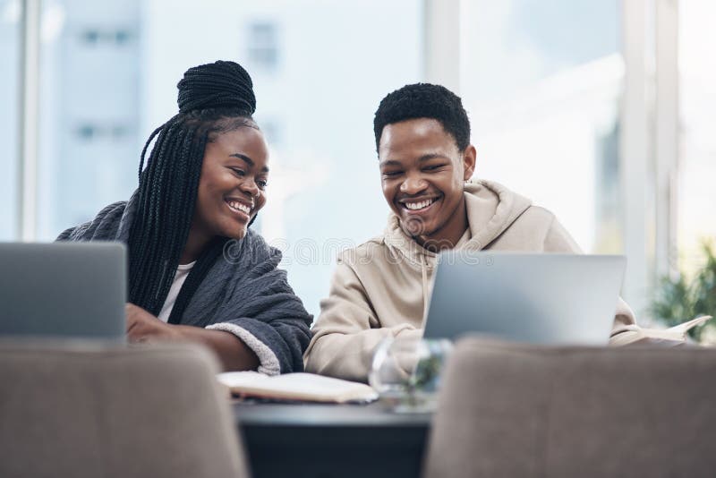 It takes love and teamwork to make lockdown work. a happy young couple working from home. stock photography