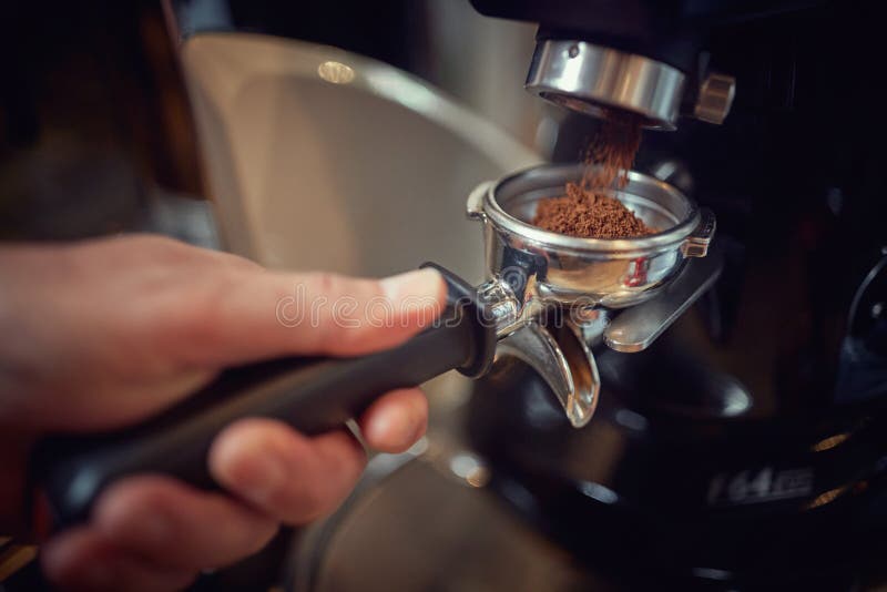 Taking a Measure of Ground Coffee from Apparatus for Making a Espresso