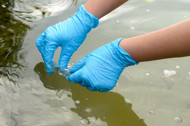Taking a Water Test for Analysis from a Reservoir. Stock Image Image