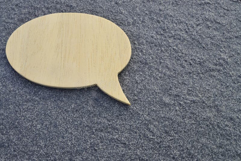 Talk bubble speech icon. blank empty bubbles design elements on dark concrete cement floor background. Chat on line symbol. copy space.