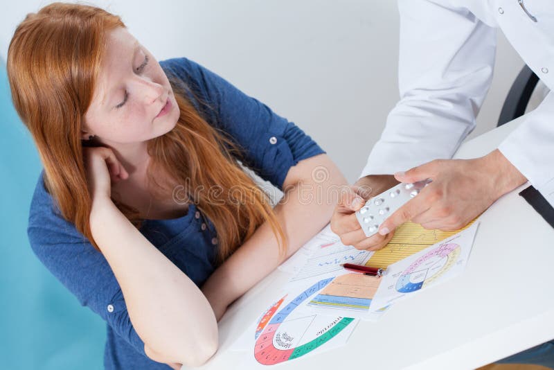 Talking about contraception with gynecologist stock photography Talking about contraception with gynecologist stock photography