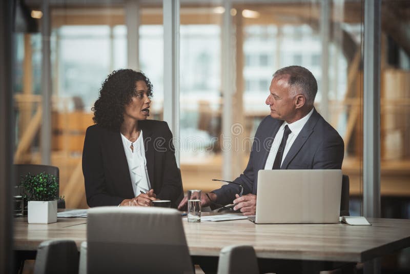 Mature Businessman Shaking Hands To Seal A Deal With His Partner And Stock Photo