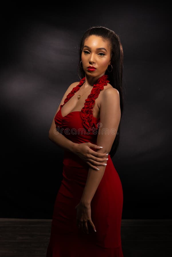 Tall brunette in red stock photo. Image of gown, girl - 156457528