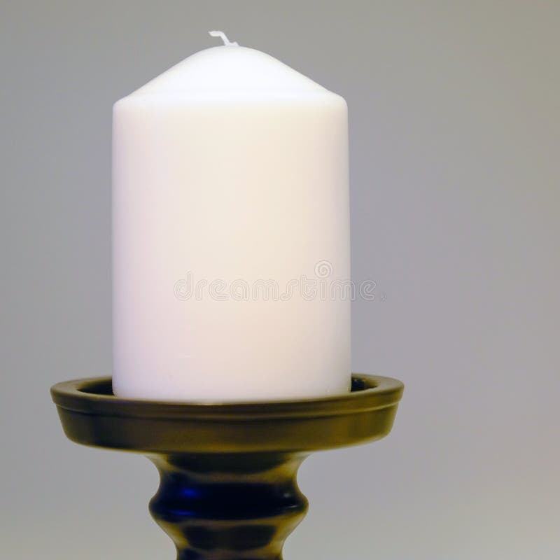 Tall Candleholders with Thin Candles in Them Stand on Dinner Table