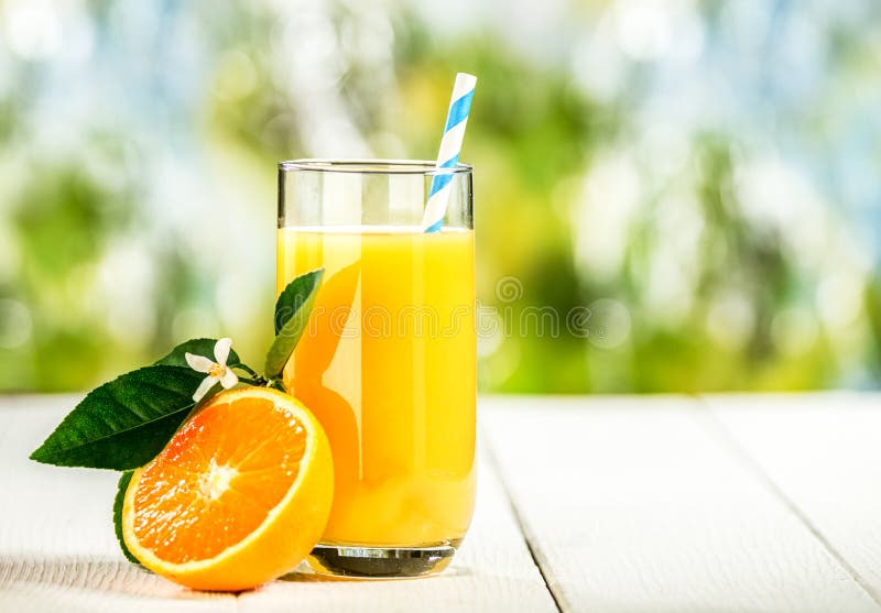 Tall glass of tasty fresh orange juice