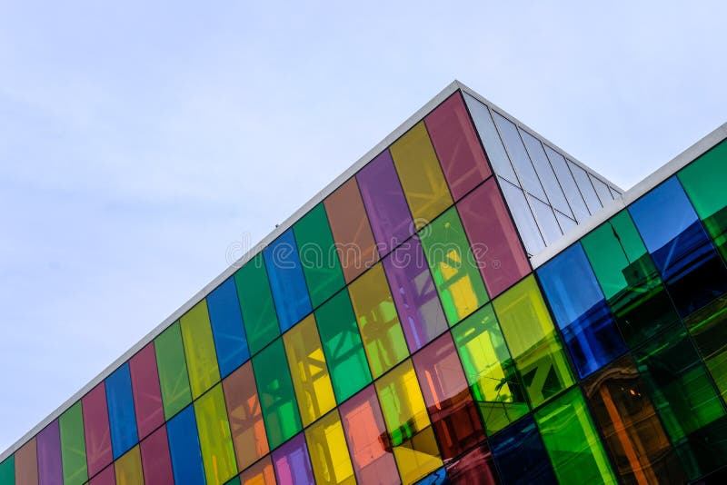 Abstract view of a modern, IT based building and offices showing the coloured glass windows.