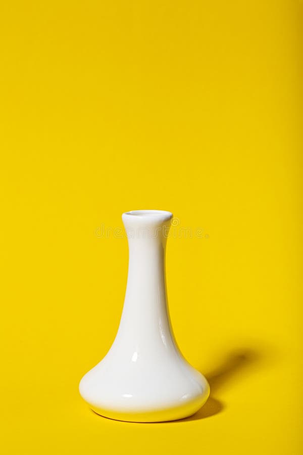 Tall Narrow White Vase on a Yellow Background Stock Photo Image of