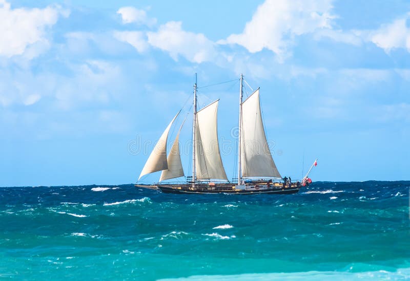 Tall Sailing Ship With Sails On Choppy Ocean. Stock Photo 