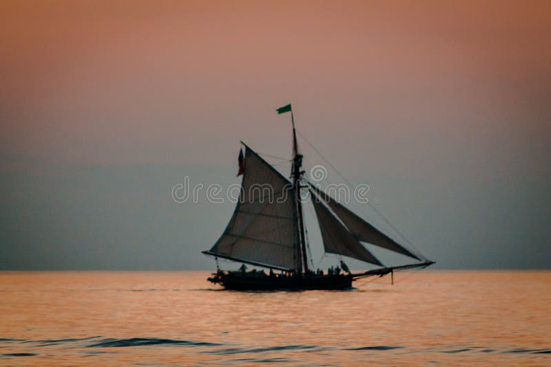 Tall ship sailing during blue hour on Lake Michigan in South Haven Michigan