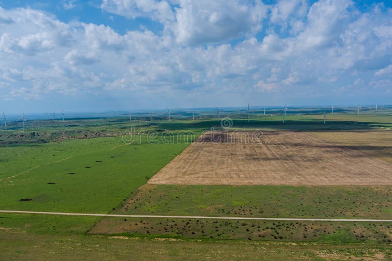 Panoramic view wind blade generators in a West Texas field of a larger wind farm. Texas wind energy turbines stock images, royalty-free photos and pictures
