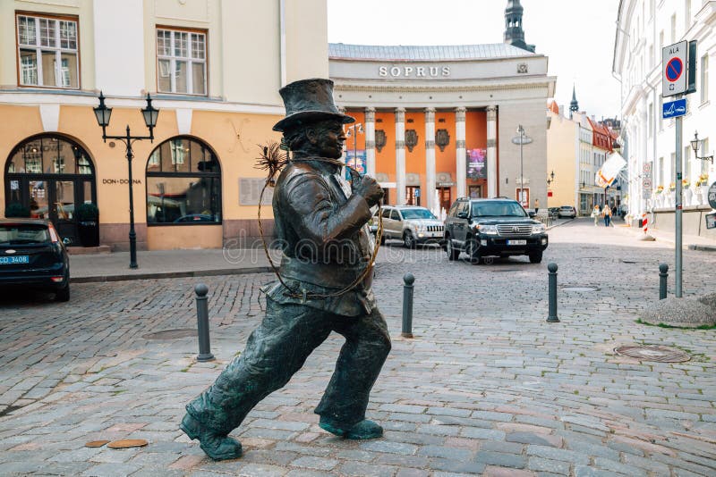 Lucky chimney sweeper sculpture in front of old town Soprus Cinema in Tallinn, Estonia