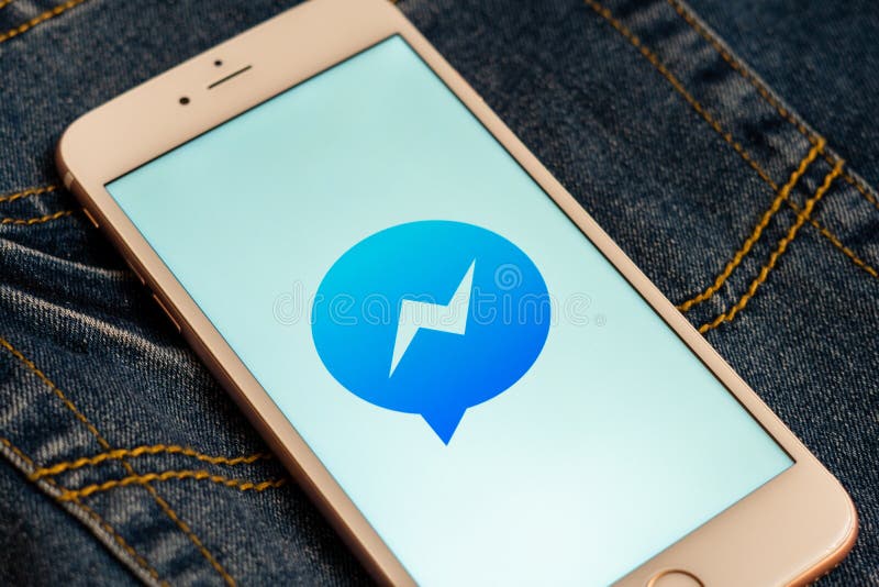 White iPhone with logo of social media Facebook Messenger on the screen. Social media icon. stock image White iPhone with logo of social media Facebook Messenger on the screen. Social media icon. stock image