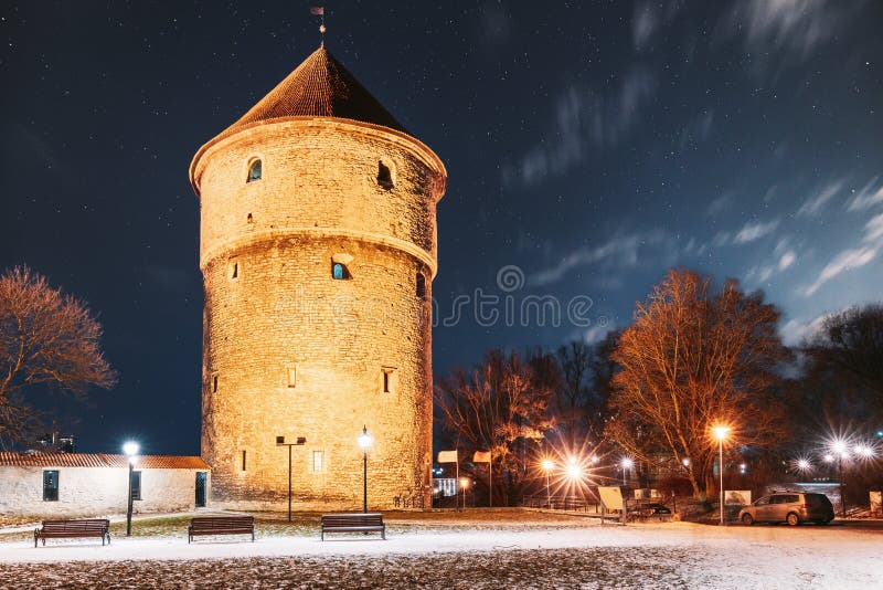 Tallinn, Estonia. Night Starry Sky Above Traditional Old Architecture Skyline In Old Town. Medieval Tower Kiek-in-de-Kok